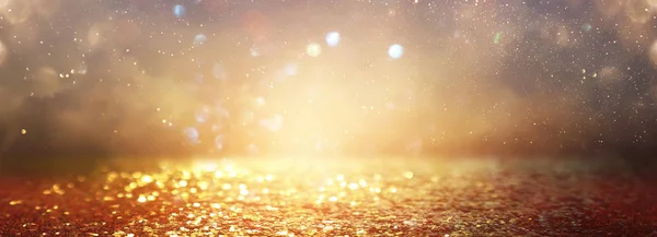 Background of abstract glitter lights. gold and black. de focused. banner — Stock Photo, Image