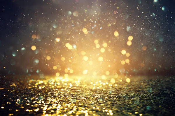 Sfondo di luci glitter astratte. oro e nero. de focalizzata — Foto Stock