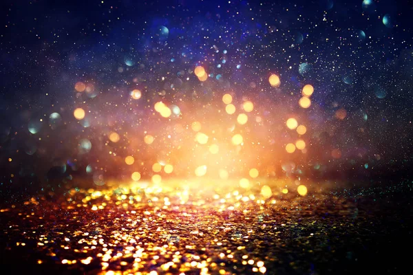 Background of abstract glitter lights. blue, gold and black. de focused — Stock Photo, Image