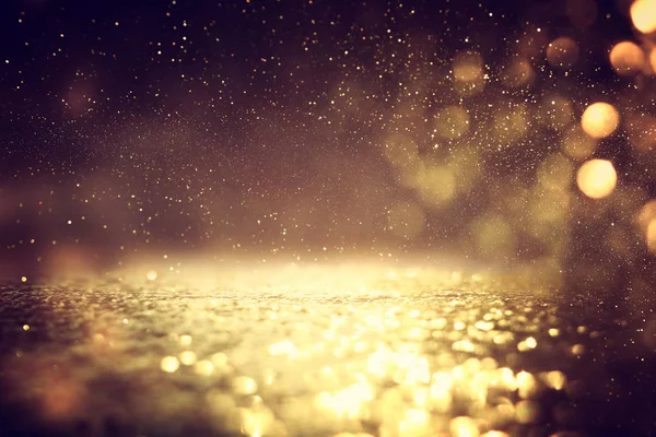 soyut glitter ışıkları arka plan. altın ve siyah. de odaklı