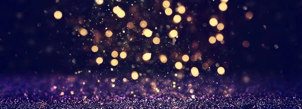 Hintergrund abstrakter Glitzerlichter. blau, gold und schwarz. Defokussiert. Banner — Stockfoto