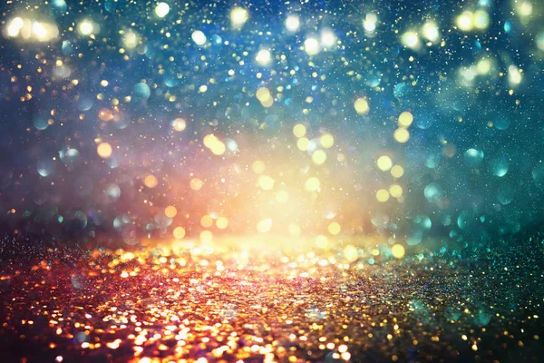 Background of abstract glitter lights. blue, gold and black. de focused — Stock Photo, Image