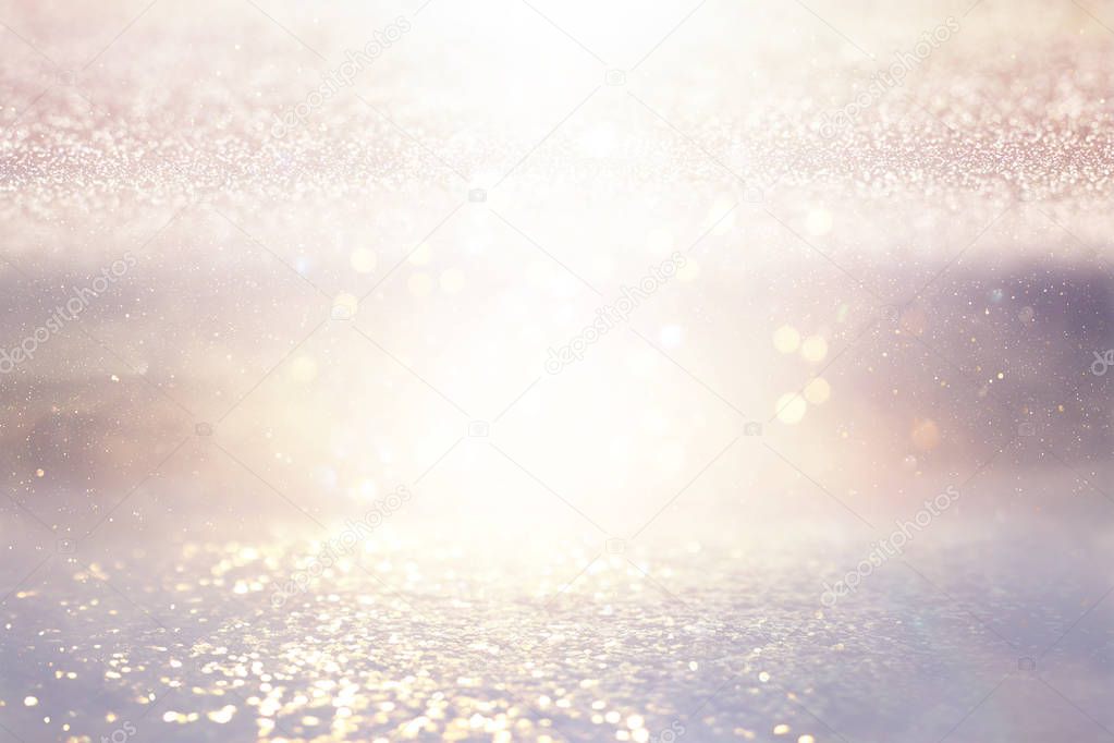 background of abstract glitter lights. silver and gold. de-focused