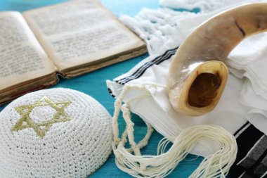 religion image of Prayer Shawl - Tallit, Prayer book and Shofar (horn) jewish religious symbols. Rosh hashanah (jewish New Year holiday), Shabbat and Yom kippur concept. clipart
