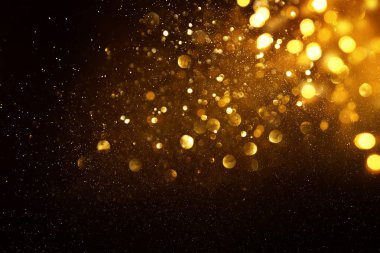 soyut glitter ışıkları arka plan. altın ve siyah. de odaklı