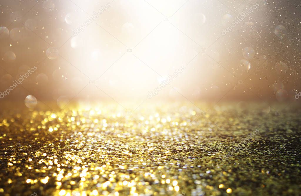 background of abstract glitter lights. silver and gold. de-focused.