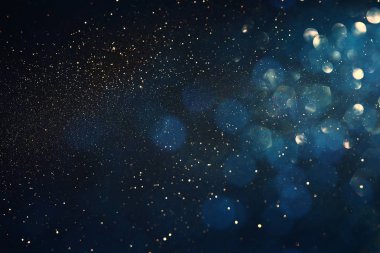 soyut glitter ışıkları arka plan. mavi, altın ve siyah. de odaklı