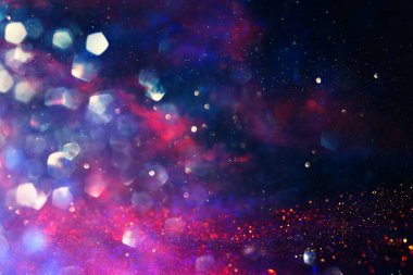 soyut kırmızı, altın ve mor parıltılı ışıklar arka plan. defokus