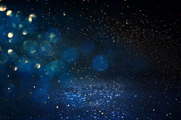 Background of abstract glitter lights. blue, gold and black. de focused — Stock Photo, Image