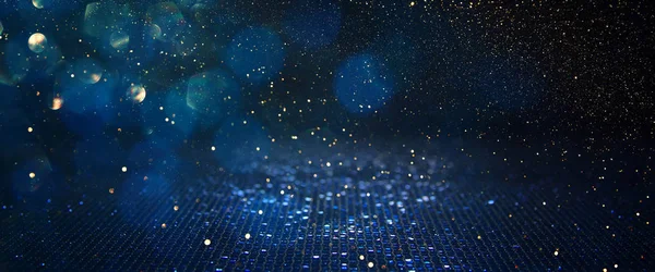 Background of abstract glitter lights. blue, gold and black. de focused. banner — Stock Photo, Image