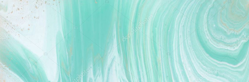 photography of abstract marbleized effect background. turquoise, gold, blue and white creative colors. Beautiful paint. banner