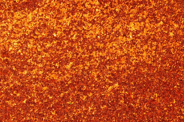 Bakgrund av guld och orange glitter ljus. de fokuserade — Stockfoto