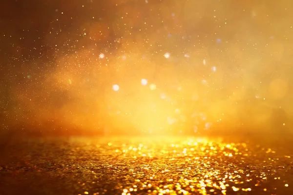 Background of gold glitter lights. de focused — Stock Photo, Image