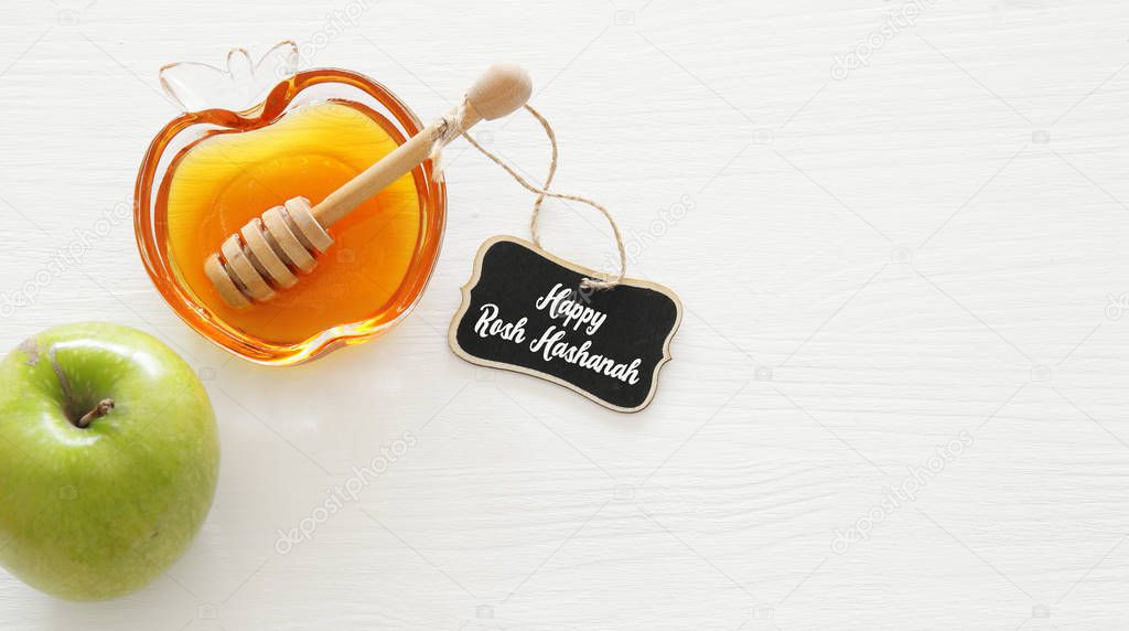 rosh hashanah (jewesh holiday) concept - honey and apple traditional holiday symbols