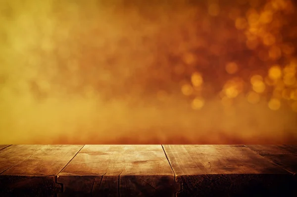 Background of wooden table in front of glitter gold bokeh lights. For product presentation — Stock Photo, Image