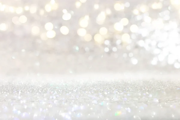 Abstract backgrounf of glitter vintage lights . silver and white. de-focused — Stock Photo, Image