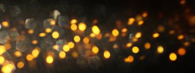 soyut glitter ışıkları arka plan. altın ve siyah. de odaklanmış. Afiş