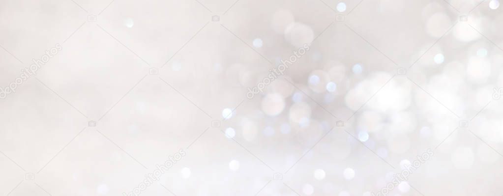 abstract backgrounf of glitter vintage lights . silver and white. de-focused. banner