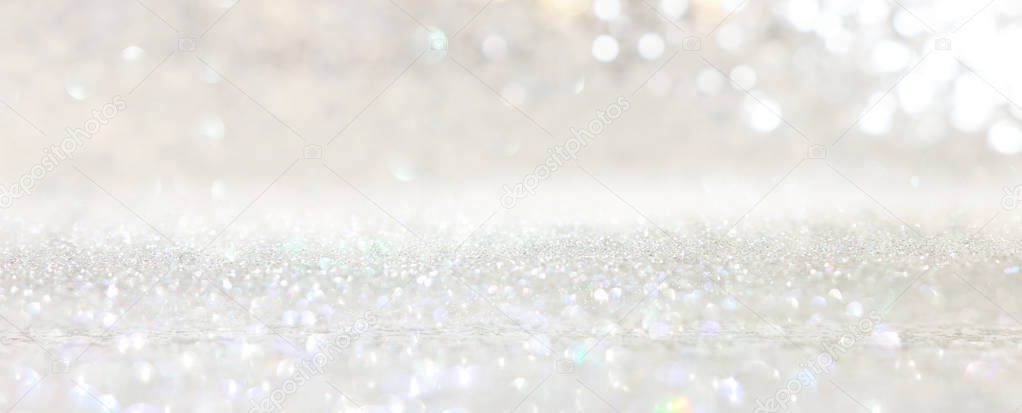 abstract backgrounf of glitter vintage lights . silver and white. de-focused. banner