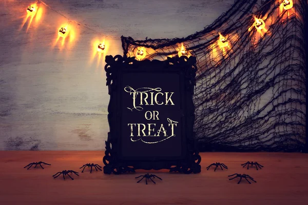 Holidays image of Halloween. photo frame with text over wooden table — Stock Photo, Image