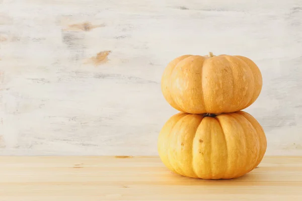 holidays Halloween image. pumpkins over wooden white table