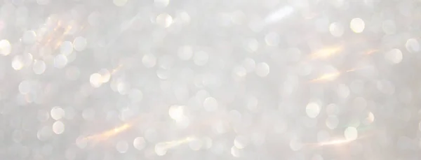 Abstract backgrounf of glitter vintage lights . silver and white. de-focused. banner — Stock Photo, Image