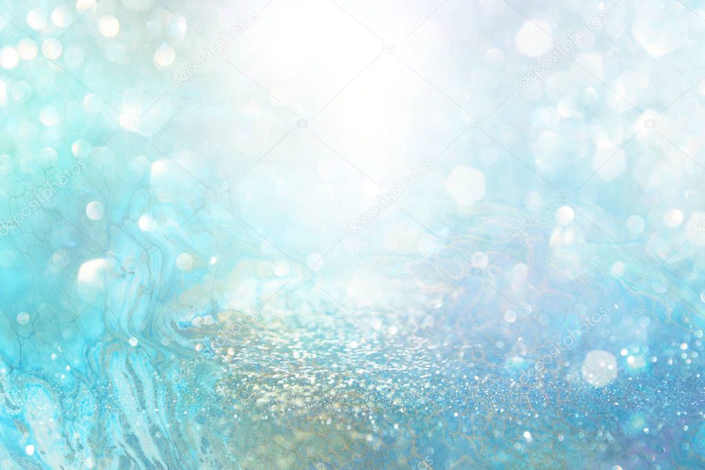 abstract glitter silver, gold , blue lights background. de-focused