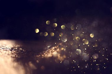soyut glitter ışıkları arka plan. altın ve siyah. de odaklı