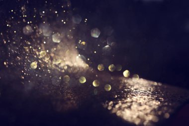 soyut glitter ışıkları arka plan. altın ve siyah. de odaklı