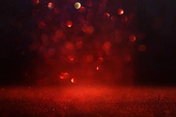Achtergrond van abstracte rode en gouden glitter lichten. gedeconcentreerd — Stockfoto