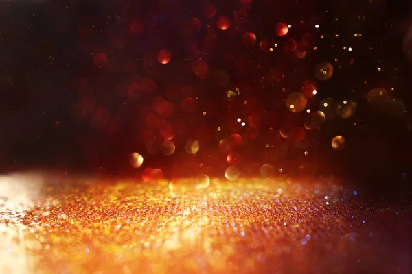 Background of abstract red and gold glitter lights. defocused — Stock Photo, Image