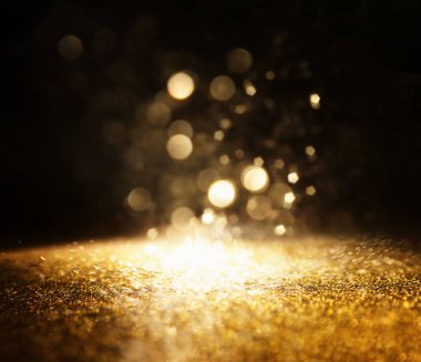 soyut glitter ışıkları arka plan. altın ve siyah. de odaklı