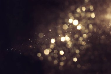 soyut glitter ışıkları arka plan. altın ve siyah. de odaklı