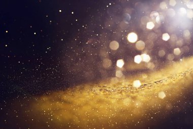 soyut glitter ışıkları arka plan. altın ve siyah. de odaklı