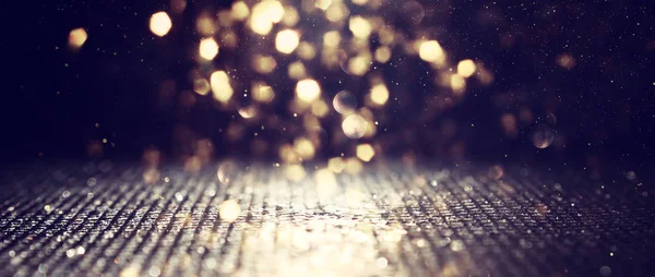 Background of abstract glitter lights. gold and black. de focused. banner — Stock Photo, Image