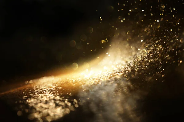 Background of abstract glitter lights. gold and black. de focused — Stock Photo, Image