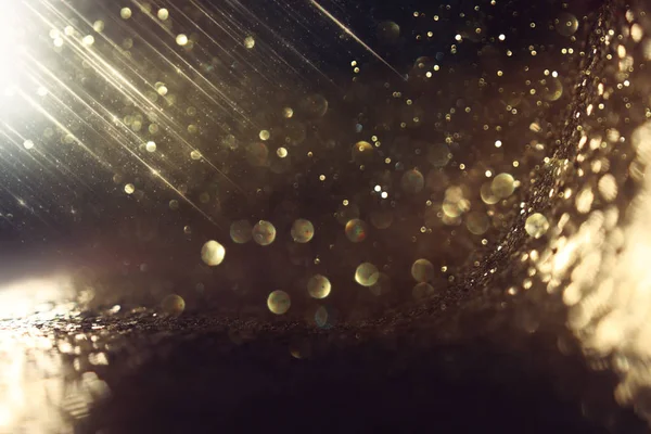 Background of abstract glitter lights. gold and black. de focused — Stock Photo, Image
