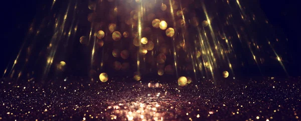 Achtergrond van abstracte glitter lichten. goud en zwart. de focus. Banner — Stockfoto