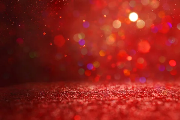 Background of abstract red, gold and black glitter lights. defocused — Stock Photo, Image