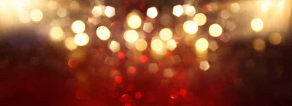 Fondo de luces abstractas de brillo rojo, oro y negro. Desenfocado. banner —  Fotos de Stock