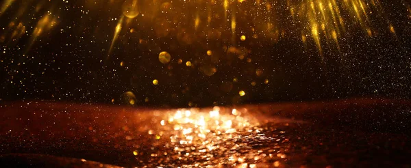 Background of abstract glitter lights. gold and black. de focused. banner — Stock Photo, Image