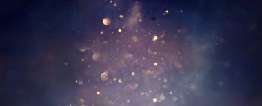 Soyut parıltılı ışıkların arkaplanı. Altın, mavi ve siyah. & Odaklan