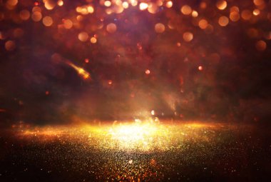 Soyut parıltılı ışıkların arkaplanı. Altın, mavi ve siyah. & Odaklan