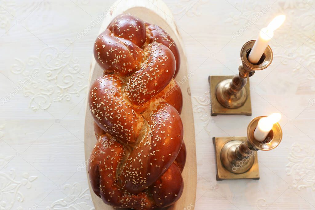 shabbat image. challah bread and candles. Top view
