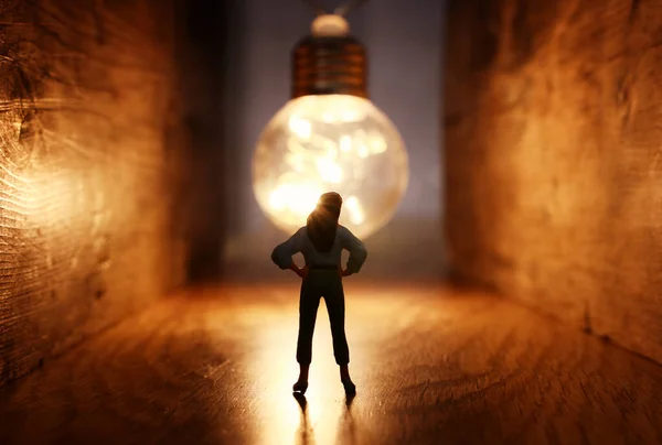 Surreal Image Person Dark Corridor Looking Glowing Light Bulb Concept — Stock Photo, Image