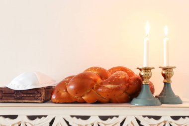 shabbat image. challah bread, shabbat wine and candles clipart
