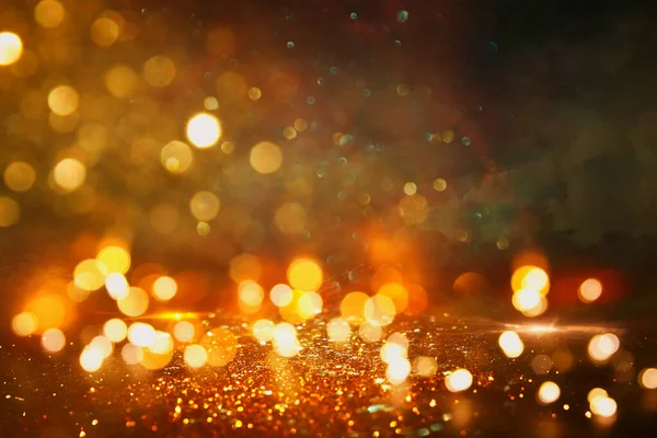 Achtergrond Van Abstract Goud Zwarte Glitter Lichten Gedeconcentreerd — Stockfoto