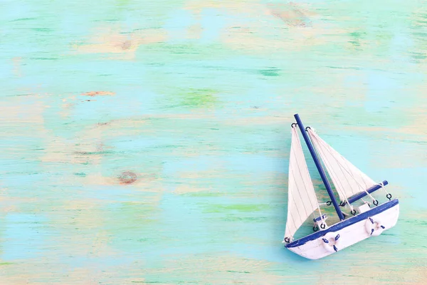 stock image wooden vintage boat over blue background