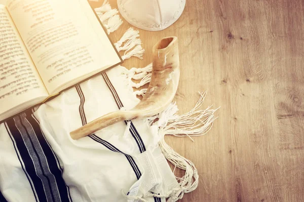 religion image of Prayer Shawl - Tallit, Prayer book and Shofar (horn) jewish religious symbols. Rosh hashanah (jewish New Year holiday), Shabbat and Yom kippur concept.