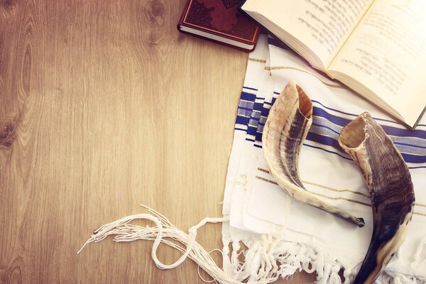 religion image of Prayer book and Shofar (horn) jewish religious symbols. Rosh hashanah (jewish New Year holiday), Shabbat and Yom kippur concept